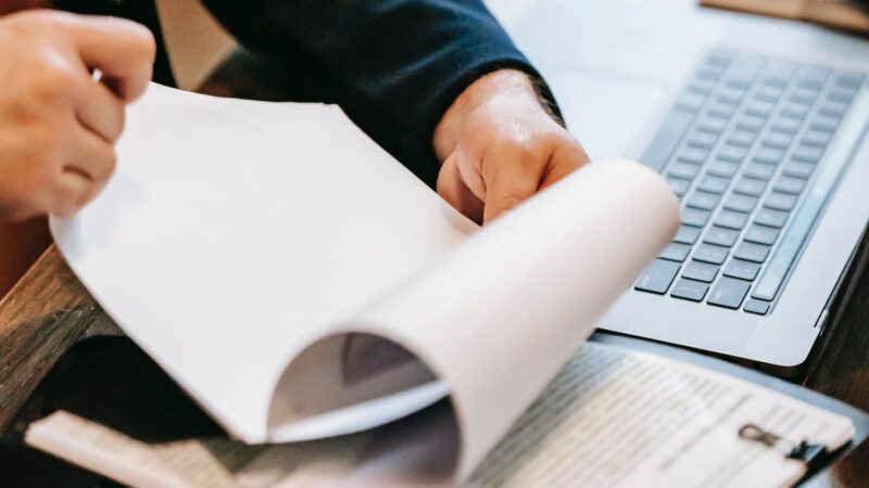 Gyoseishoshi Lawyer helping client with paperwork